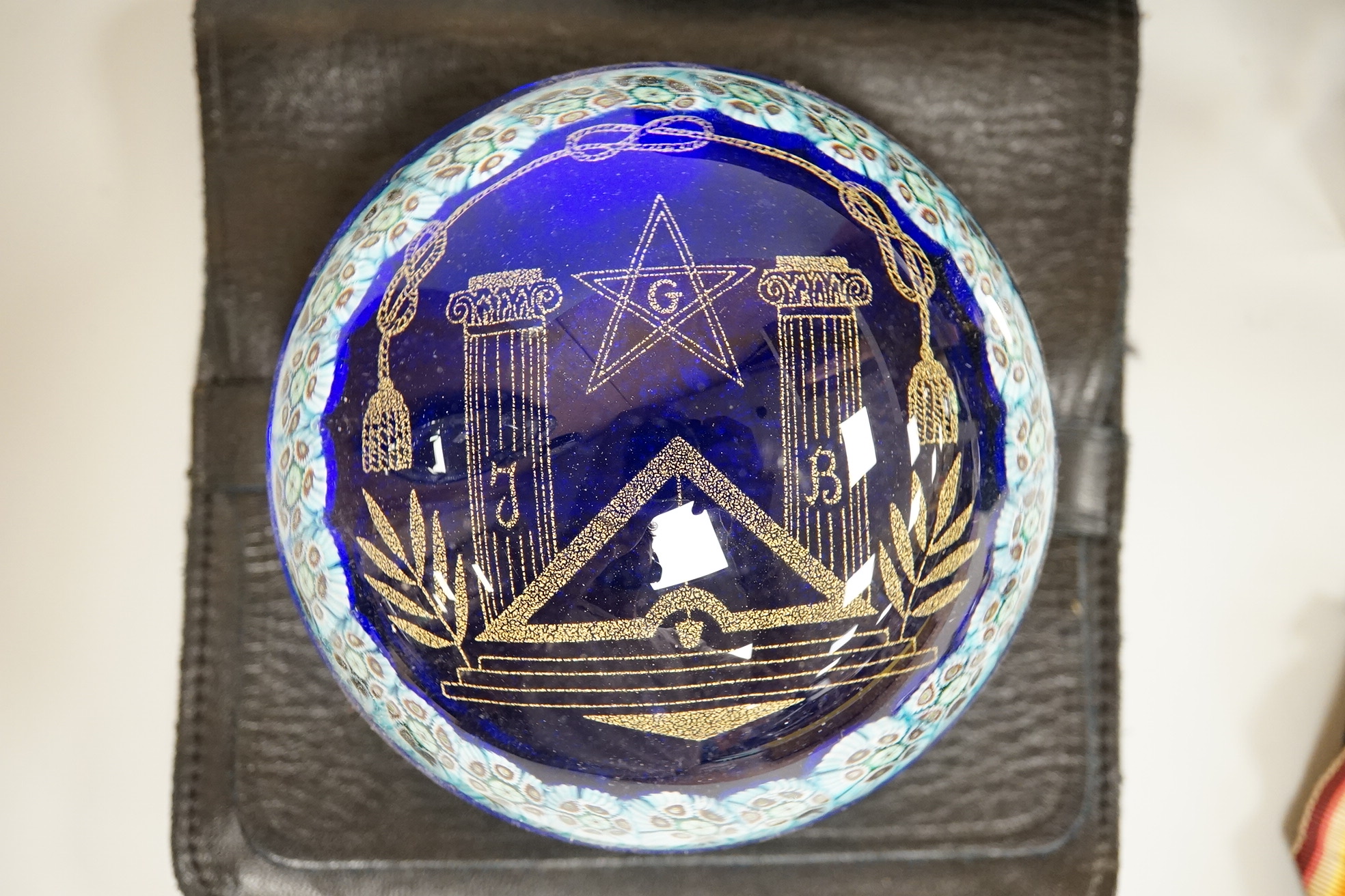 Masonic collectables including three paperweights, a cigarette box and two ribboned medals